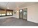 Enclosed lanai with tiled floors, many windows, and sliding glass doors that lead to the main house at 5805 Hutton Dr, Orlando, FL 32808