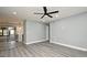 This living room features modern flooring, recessed lighting, a ceiling fan, and neutral paint throughout at 5805 Hutton Dr, Orlando, FL 32808