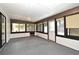 Bright sunroom with many windows and a door leading to the outside at 5805 Hutton Dr, Orlando, FL 32808