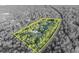 A yellow boundary line shows an aerial view of a green parcel with surrounding trees and roads in muted colors at 595 Seminole Woods Blvd, Geneva, FL 32732