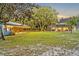 Expansive backyard with an enclosed pool and covered horse stables on the property at 595 Seminole Woods Blvd, Geneva, FL 32732