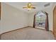 Empty carpeted bedroom featuring a large window seat and ceiling fan at 595 Seminole Woods Blvd, Geneva, FL 32732