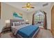 Cozy bedroom with a large window seat, plush bedding, and modern decor at 595 Seminole Woods Blvd, Geneva, FL 32732