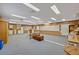 Spacious classroom area with wood paneled walls and ample lighting, perfect for flexible learning arrangements at 595 Seminole Woods Blvd, Geneva, FL 32732