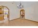 Bright dining room with hardwood floors, chandelier, and arched doorways at 595 Seminole Woods Blvd, Geneva, FL 32732