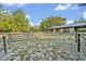View of fenced in horse pen and stables on the property at 595 Seminole Woods Blvd, Geneva, FL 32732