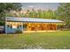 Charming horse stables with open stalls, string lights, and a rustic design at 595 Seminole Woods Blvd, Geneva, FL 32732