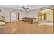 Bright living room featuring hardwood floors, neutral walls, and natural light at 595 Seminole Woods Blvd, Geneva, FL 32732