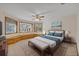 Serene main bedroom with natural light, built-in bench, and neutral tones at 595 Seminole Woods Blvd, Geneva, FL 32732