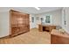 Bright office space with hardwood floors, a large desk, and ample storage, ideal for productivity at 595 Seminole Woods Blvd, Geneva, FL 32732