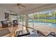 Cozy sunroom with tiled floors, wicker furniture, and a view of the sparkling pool at 595 Seminole Woods Blvd, Geneva, FL 32732
