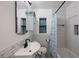 Bathroom featuring subway tile, updated vanity, modern fixtures, and mosaic-tile inlays at 6 S Lakewood Dr, Orlando, FL 32803