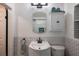 Updated bathroom featuring white vanity, modern fixtures, and subway tiling at 6 S Lakewood Dr, Orlando, FL 32803