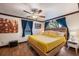 Well-lit bedroom with a queen-size bed, modern ceiling fan, and stylish décor at 6 S Lakewood Dr, Orlando, FL 32803