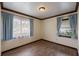 Cozy bedroom with hardwood floors and dual windows for lots of light at 6 S Lakewood Dr, Orlando, FL 32803