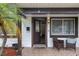 Inviting front porch with tiled floor, seating, and a glimpse into the home's interior at 6 S Lakewood Dr, Orlando, FL 32803
