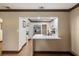 Open concept kitchen with stainless steel appliances and bright white countertops at 6 S Lakewood Dr, Orlando, FL 32803