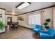 Spacious living and dining area with tile flooring and abundant natural light at 6 S Lakewood Dr, Orlando, FL 32803