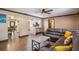 Open-concept living room with wood floors connecting to a modern kitchen, great for entertaining at 6 S Lakewood Dr, Orlando, FL 32803