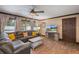 Living room featuring large leather sofa, hardwood floors, and natural light at 6 S Lakewood Dr, Orlando, FL 32803