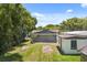 Wide shot of backyard with building featuring a dark roof, perfect for outdoor gatherings at 612 Florida Ave, St Cloud, FL 34769