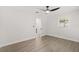This is a simple bedroom with light-colored walls, vinyl floor, and a window that provides natural light at 612 Florida Ave, St Cloud, FL 34769
