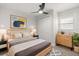 This bedroom is modern with a dresser and nightstand flanking each side of the bed and closet at 612 Florida Ave, St Cloud, FL 34769