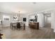 The dining room and kitchen feature an open-concept design with modern lighting and sleek countertops at 612 Florida Ave, St Cloud, FL 34769