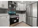 Contemporary kitchen featuring stainless steel appliances, sleek white cabinetry, and modern design elements at 612 Florida Ave, St Cloud, FL 34769
