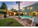 A backyard oasis with a pool, tiki bar, and lounge chairs, perfect for outdoor entertaining at 640 Lasso Dr, Kissimmee, FL 34747