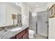 Bathroom with granite countertops, modern fixtures, and tiled glass shower at 640 Lasso Dr, Kissimmee, FL 34747