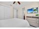 Bedroom features a ceiling fan, TV, and access to the ensuite bathroom at 640 Lasso Dr, Kissimmee, FL 34747