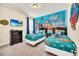 Fun bedroom featuring cartoon themed decor, twin beds, and a mounted television at 640 Lasso Dr, Kissimmee, FL 34747
