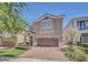 Charming two-story home with a brick driveway, well-maintained landscaping, and a neutral color scheme at 640 Lasso Dr, Kissimmee, FL 34747