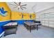 Entertaining game room with air hockey, ping pong, foosball, and basketball hoop at 640 Lasso Dr, Kissimmee, FL 34747