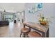 Open-concept living area with a view of the pool, adorned with a stylish bar table and seating at 640 Lasso Dr, Kissimmee, FL 34747