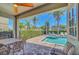 Relaxing patio view with a dining table and a plunge pool at 640 Lasso Dr, Kissimmee, FL 34747