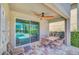 Outdoor patio featuring a ceiling fan and outdoor chairs and table at 640 Lasso Dr, Kissimmee, FL 34747