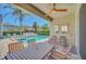 Outdoor patio features a pool, spa, ceiling fan, outdoor chairs and table at 640 Lasso Dr, Kissimmee, FL 34747