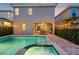 A sparkling pool and patio with lounge chairs, and outdoor dining offering a luxurious outdoor living at 640 Lasso Dr, Kissimmee, FL 34747