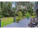 Relaxing back deck overlooking a spacious backyard filled with lush foliage at 750 W May St, Deland, FL 32720