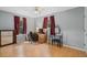 Bright bedroom featuring two large windows, desk and chair setup, and a vanity with a mirror at 750 W May St, Deland, FL 32720