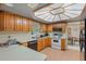 Well-lit kitchen with wood cabinets and modern appliances, ready for cooking at 750 W May St, Deland, FL 32720