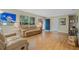 Comfortable living room with a large window and hardwood floors at 750 W May St, Deland, FL 32720