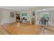 Open concept living room with hardwood floors and access to dining area at 750 W May St, Deland, FL 32720