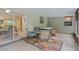 Enclosed patio featuring a hot tub, table and chairs, and tiled floor, perfect for outdoor relaxation at 750 W May St, Deland, FL 32720