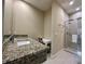 Elegant bathroom with granite countertops, glass-enclosed shower and vanity at 7667 Recife Dr, Kissimmee, FL 34747