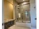 Bathroom featuring shower with sliding glass doors and granite vanity top at 7667 Recife Dr, Kissimmee, FL 34747