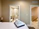 Spacious bedroom shows view into ensuite bathroom with a large walk-in shower at 7667 Recife Dr, Kissimmee, FL 34747