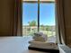 Relaxing bedroom view of neighborhood from a bright, sunny window at 7667 Recife Dr, Kissimmee, FL 34747
